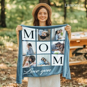 May include: A blue fleece blanket with a photo collage of a family. The blanket features the word "MOM" in large white letters and the phrase "Love you to the moon and back" in white script.
