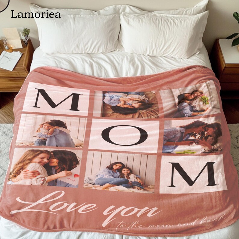 May include: A pink fleece blanket with a photo collage of a mother and her children. The blanket has the word "MOM" spelled out in black letters and the phrase "Love you to the moon and back" in white cursive writing.