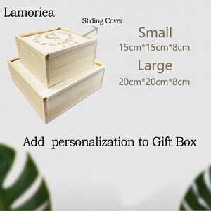 May include: Two wooden gift boxes with sliding lids. The smaller box measures 15cm x 15cm x 8cm and the larger box measures 20cm x 20cm x 8cm. The boxes are made of natural wood and have a simple, elegant design.