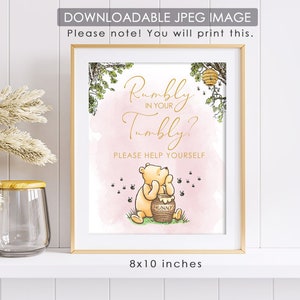 May include: Printable 8x10 inch sign featuring Winnie the Pooh with a pink background and gold text. The sign says "Rumbly in your tumbly? Please help yourself".