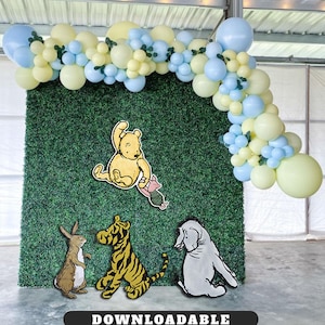 May include: A party backdrop featuring a green hedge wall, adorned with cartoon character cutouts and a balloon arch in pastel yellow and blue. The characters include Winnie the Pooh, Piglet, Tigger, Rabbit, and Eeyore. The word "DOWNLOADABLE" is at the bottom.