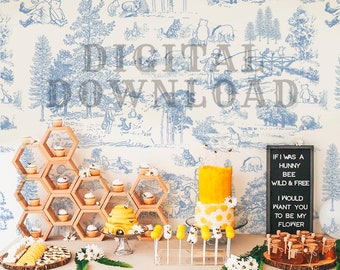 May include: A Winnie the Pooh themed party backdrop with a blue and white pattern of Winnie the Pooh and his friends. The backdrop is decorated with a honeycomb-shaped shelf, a yellow cake with white polka dots, and a sign that reads "If I was a hunny bee wild & free I would want you to be my flower".
