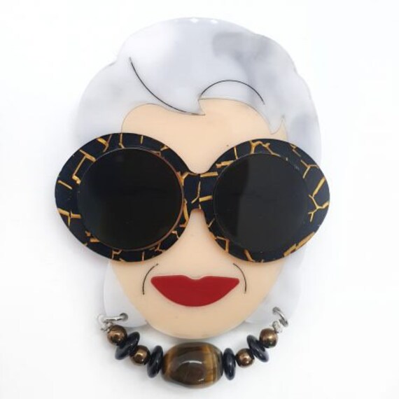 Iris apfel brooch deals
