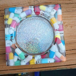 Transparent capsule/pill holographic ashtray