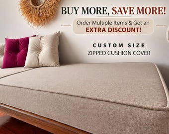 May include: A beige rectangular cushion cover on a wooden bench, accompanied by two beige and one magenta tufted square pillows. Text on the wall reads: BUY MORE, SAVE MORE! Order Multiple Items & Get an EXTRA DISCOUNT! CUSTOM SIZE ZIPPED CUSHION COVER.