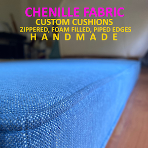 May include: Close-up of a blue chenille fabric cushion with piped edges. The cushion is zippered and foam filled. The text "CHENILLE FABRIC CUSTOM CUSHIONS ZIPPERED, FOAM FILLED, PIPED EDGES HANDMADE" is visible in the image.
