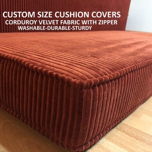 May include: Close-up of a red corduroy cushion cover with a zipper. The cover is made of a soft, durable fabric and has a ribbed texture. CUSTOM SIZE CUSHION COVERS CORDUROY VELVET FABRIC WITH ZIPPER WASHABLE-DURABLE-STURDY