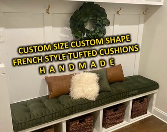May include: A custom-built bench with a tufted, dark green cushion and several decorative pillows. The bench is part of a built-in storage unit with woven baskets. The text on the image reads "CUSTOM SIZE CUSTOM SHAPE FRENCH STYLE TUFTED CUSHIONS HANDMADE."