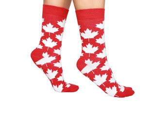 May include: A pair of red socks with a white maple leaf pattern.