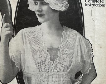 May include: Vintage black and white image of a woman wearing a crocheted hat and dress, holding a hand mirror. The image is from a book titled "Boudoir Negligees and Tatting with Complete Instructions" by Adeline Cordet.