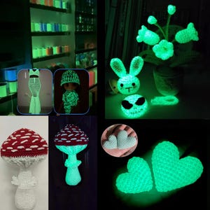 May include: A collection of glow-in-the-dark crochet items including a long dress, a doll in a hat, a potted flower, a rabbit head, a skull, two mushrooms with red and white caps, and several heart-shaped pieces that emit a bright green light.