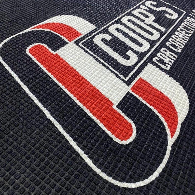 a close up of a floor with a logo on it