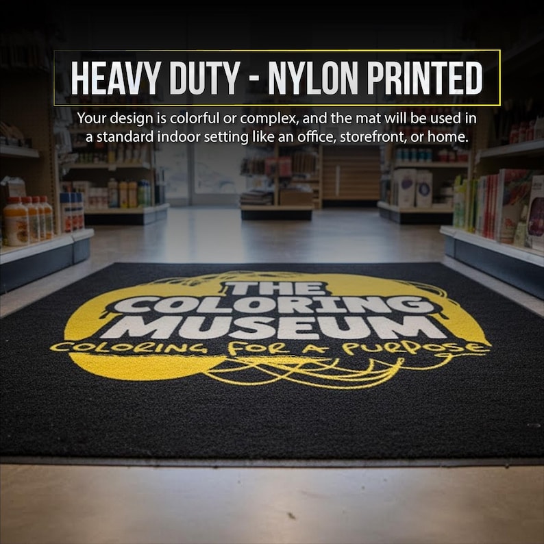 a large, colorful mat with the text "THE COLORING MUSEUM" printed on it, located in a store or similar indoor setting.
