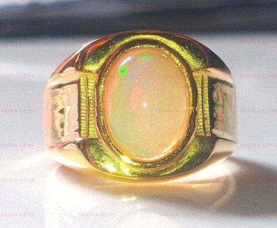 ANELLO CON OPALE DI FUOCO E DIAMANTI - Asta GIOIELLI - Casa d'Aste ANELLO CON OPALE DI FUOCO E DIAMANTI - Asta GIOIELLI - Casa d'Aste