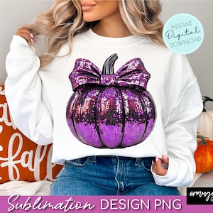 May include: White sweatshirt featuring a large, sequined purple pumpkin with a black bow. The design includes the text "Instant Digital Download" and "Sublimation DESIGN PNG". The overall theme is fall and Halloween.