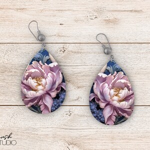 May include: A pair of teardrop-shaped earrings with a floral design. The earrings feature a pink peony flower with blue and green leaves on a dark blue background.
