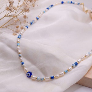 Handmade necklace with protective nazar eye in blue/white