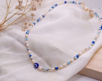 Handmade necklace with protective nazar eye in blue/white