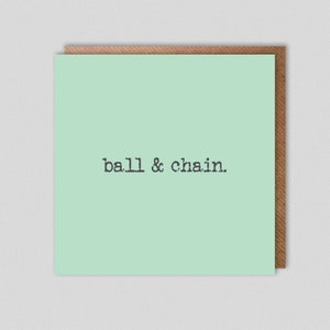 Puede incluir: Una tarjeta verde claro con el texto "ball & chain." impreso en negro.