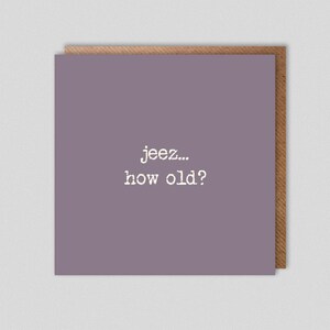 May include: A purple card with the text "jeez... how old?" printed in white.
