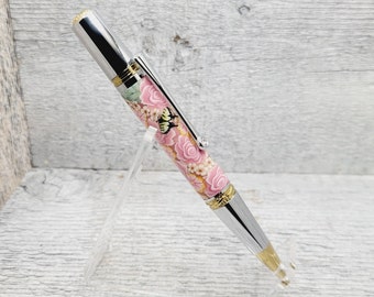 Majestic Squire Ballpoint pen in Chrome/Gold Ti finish with a beautiful Pink Rose & Butterfly Polymer Clay body. Hand turned and assembled.