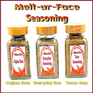 May include: Three glass jars with brown lids filled with spices. The labels read "Melt-ur-Face Cajun Rub 5oz", "Melt-ur-Face Everyday Seasoning 6oz", and "Melt-ur-Face Taco Seasoning 4oz".