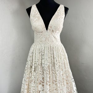 Elegant Lace Wedding Gown with Deep V-Neckline | Romantic A-Line Bridal Dress with Floral Embroidery