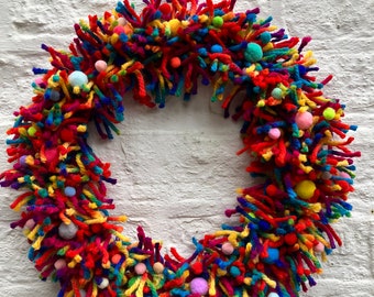 Gorgeous sustainable mixed rainbow wool wreath,ring,door,wall hanging with felt pom-poms size 16”