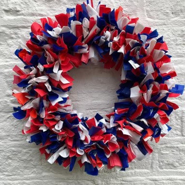 Stunning red, white and blue showerproof rag wreath size 15”