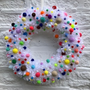 Stunning white sustainable wool wreath,ring, wall, door hanging with multicoloured felt pom-poms size 15”