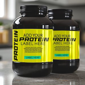 May include: Two black plastic containers with yellow labels that say "Add Your Protein Label Here". The labels have black text and a white background.