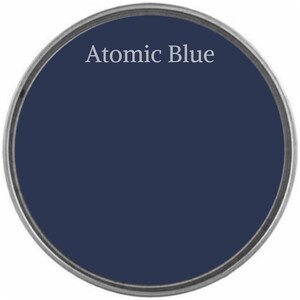 May include: A round paint can lid with the text "Atomic Blue" printed in white on a dark blue background.