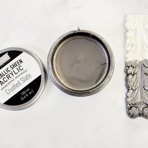 May include: A small tin of metallic sheen acrylic paint in the color Crushed Slate. The tin is open and the paint is visible. The paint is a dark gray color with a metallic sheen.