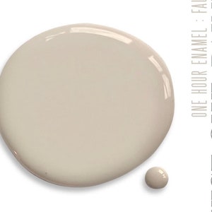 May include: A sample of light beige paint in a round drop with a smaller drop next to it. The text "ONE HOUR ENAMEL : FAUNA" is visible on the right side of the image.