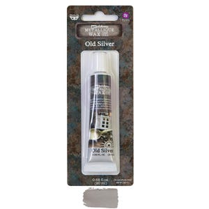 May include: A tube of Art Alchemy Metallic Wax in the color Old Silver. The tube is 0.68 fl oz (20 ml) and has a silver metallic finish. The packaging is a silver and black cardboard with the product name and color printed on it.