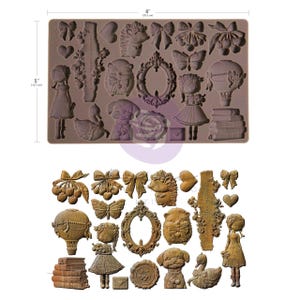 May include: A brown silicone mold with various decorative elements, including bows, hearts, a girl, a dog, a butterfly, and a hot air balloon. The mold measures 8 inches (20.3 cm) wide and 5 inches (12.7 cm) high.