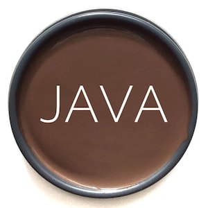 May include: A close-up of a brown paint sample with the word "JAVA" written in white.