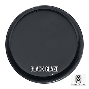 May include: A black glaze paint in a round container with the text "BLACK GLAZE" printed on the front.