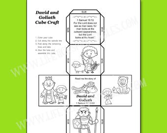 May include: A black and white printable paper craft sheet for a David and Goliath cube. The layout includes assembly instructions, tabs labeled glue, and six square panels featuring line art illustrations of biblical figures, a lion, and text.