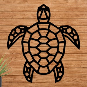 May include: Black geometric silhouette of a sea turtle on a wood background.