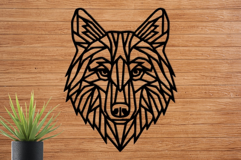 May include: Black geometric wolf head wall decor made of metal. The wolf's head is stylized with a geometric design and has a detailed face.