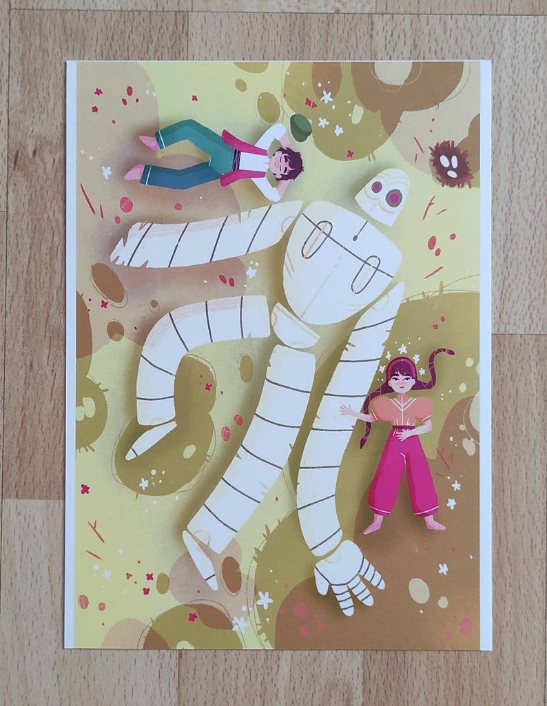 May include: A white, segmented, humanoid figure with striped limbs is lying on a yellow and brown background with small white flowers. Two figures, one in blue and one in red, are lying on top of the figure.
