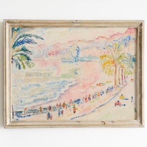 May include: Watercolor painting of a beach scene with palm trees, people, and buildings. The artwork features a pastel color palette with pink, blue, and yellow hues. The painting is framed in a gold-colored wooden frame.