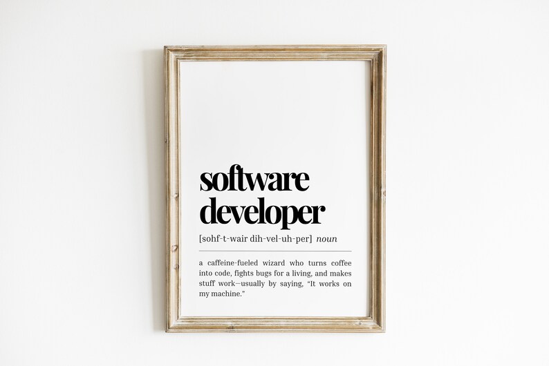 May include: A framed print with a black and white definition of a "software developer" with the pronunciation and a humorous description of the job.
