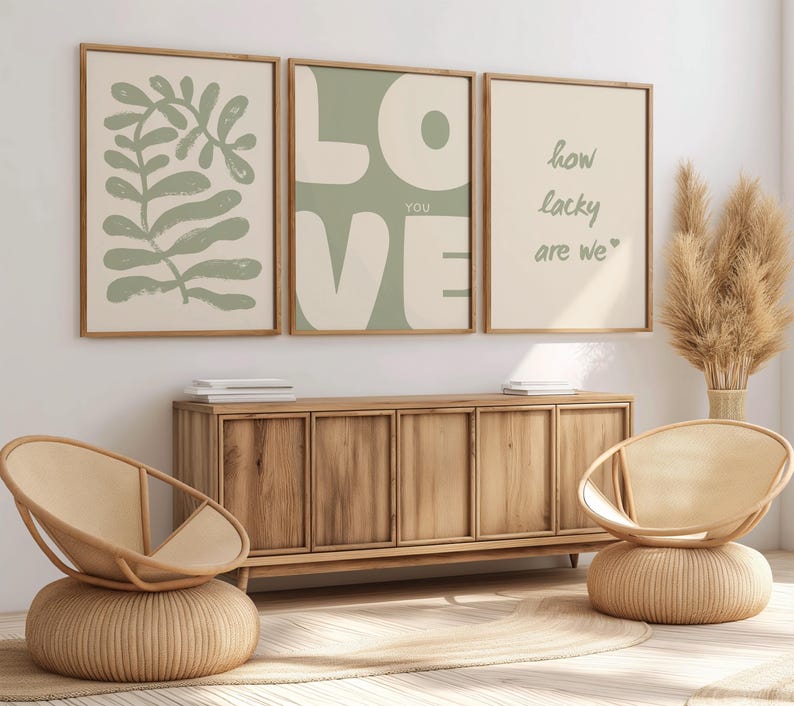 May include: Three framed prints with a green background. The left print features a green leaf design. The middle print has the word "LOVE" in large white letters with the word "YOU" in smaller letters below. The right print has the text "how lucky are we" in white lettering.