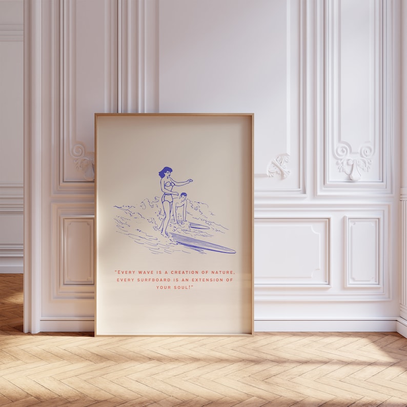 May include: A vintage-style illustration of a woman and a man surfing on a wave. The illustration is in blue and white on a beige background. The text below the illustration reads: "EVERY WAVE IS A CREATION OF NATURE. EVERY SURFBOARD IS AN EXTENSION OF YOUR SOUL."