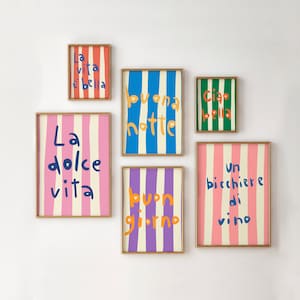 Puede incluir: Seis impresiones enmarcadas con fondos rayados coloridos y frases italianas. Las frases son "La vita e bella", "Buona notte", "Ciao bella", "La dolce vita", "Buon giorno", y "Un bicchiere di vino".