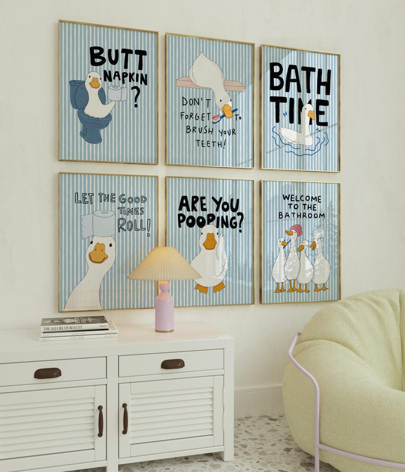 May include: Six framed wall art prints featuring cartoon ducks on a light blue and white striped background. The prints include text such as Butt Napkin, Don't Forget To Brush Your Teeth, Bath Time, Let The Good Times Roll, Are You Pooping, and Welcome To The Bathroom.
