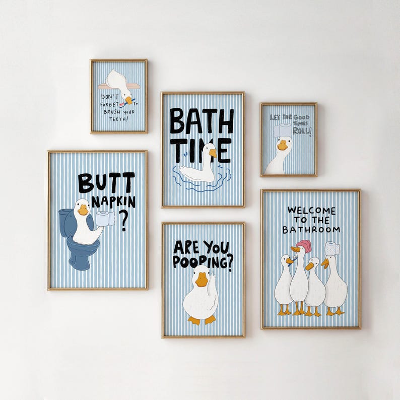 May include: A set of six framed wall art prints featuring white ducks on a light blue and white vertical striped background. The prints include humorous text such as "Bath Time," "Butt Napkin?," "Are You Pooping?," and "Welcome to the Bathroom."