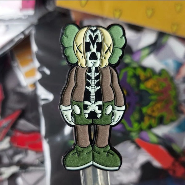 Skull Kaws glow in dark enamel pin